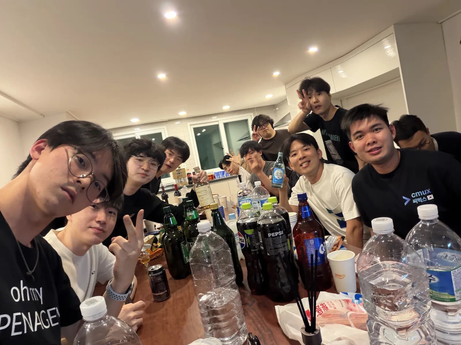 Friends gathered around the long table at VYV House